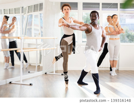 Adult man and adult woman rehearsing pair ballet Adult man and adult woman rehearsing pair ballet 139316148