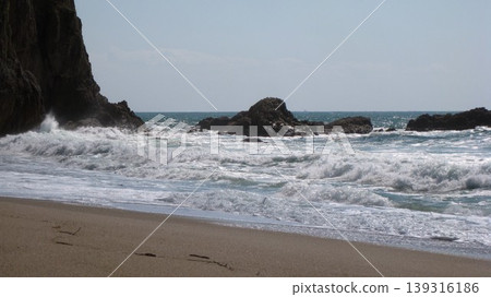 The clear blue spring sky, the rough Sea of Japan, and towering, strangely shaped rocks. The clear blue spring sky, the rough Sea of Japan, and towering, strangely shaped rocks. 139316186