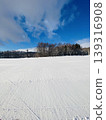 Footprints following the snowy field 139316908