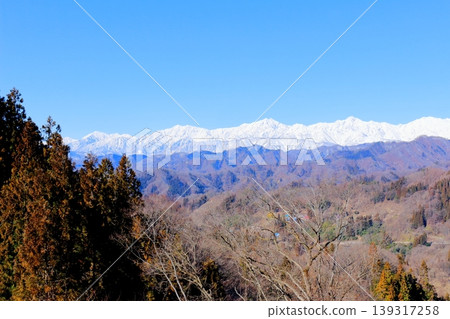 The Northern Alps from Ogawa Village in March; the snow-capped Northern Alps; the mountains of Shinshu. 139317258