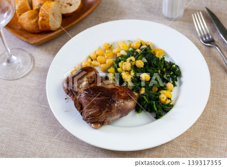 Baked or fried veal in plate with cheakpea Baked or fried veal in plate with cheakpea 139317355