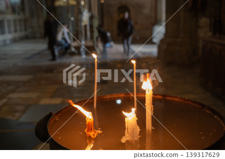 [Jerusalem] Christians offering prayers and candles inside the Church of the Holy Sepulchre in the Old City 139317629