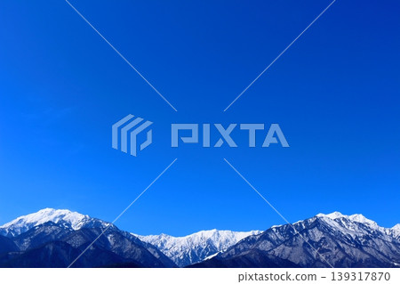 The Northern Alps from Shinano-Omachi in March; the snow-capped Northern Alps; the mountains of Shinshu. The Northern Alps from Shinano-Omachi in March; the snow-capped Northern Alps; the mountains of Shinshu. 139317870