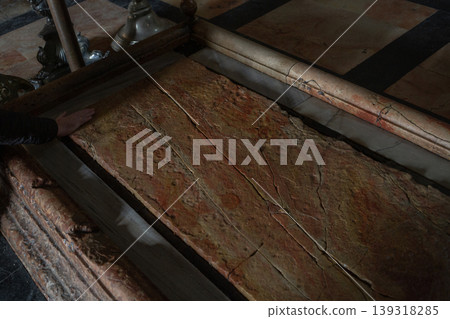 [Jerusalem] A stone tablet believed to be the slab on which the deceased Jesus Christ lay, displayed inside the Church of the Holy Sepulchre in the Old City. 139318285