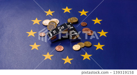 A silver bar, white metal against a backdrop of EU flag, as a concept. A silver bar A silver bar, white metal against a backdrop of EU flag, as a concept. A silver bar 139319158