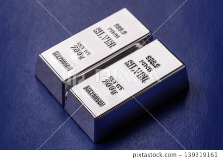 A silver bar, white metal against a backdrop of EU flag, as a concept. A silver bar 139319161