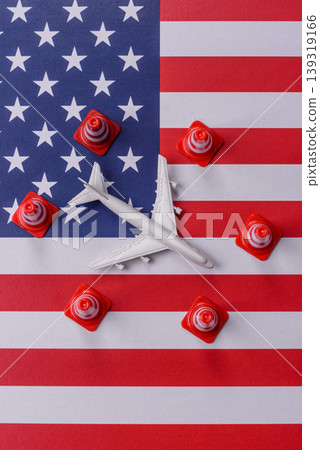 A mock up of airplane with no fly signs on a US flag as a concept for a flight ban A mock up of airplane with no fly signs on a US flag as a concept for a flight ban 139319166