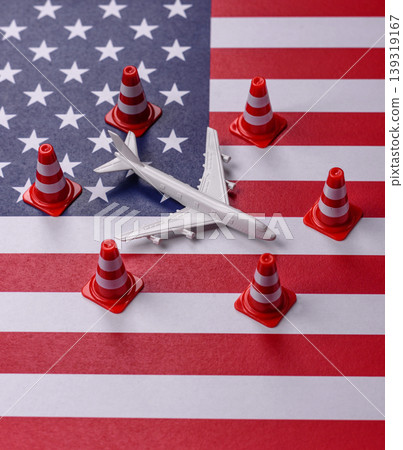 A mock up of airplane with no fly signs on a US flag as a concept for a flight ban A mock up of airplane with no fly signs on a US flag as a concept for a flight ban 139319167