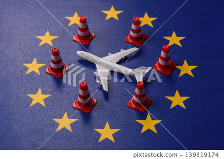 A mock up of airplane with no fly signs on a US flag as a concept for a flight ban A mock up of airplane with no fly signs on a US flag as a concept for a flight ban 139319174