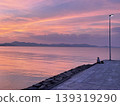 A peaceful moment watching the sunset on the beach of Teshima Island in the Seto Inland Sea. 139319290