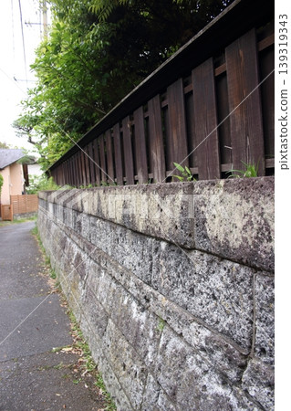 Wooden fence and stone wall Wooden fence and stone wall 139319343
