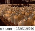 The chapel is gently illuminated by the light of countless candles and silence. 139319540