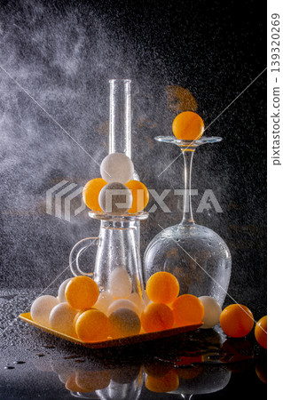 Still life with marbles, glassware, and water splashes Still life with marbles, glassware, and water splashes 139320269