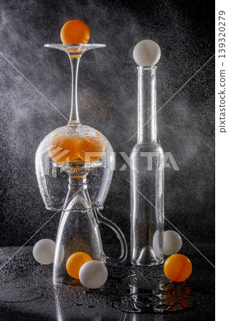 Still life with marbles, glassware, and water splashes Still life with marbles, glassware, and water splashes 139320279