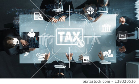 Aerial view of a business meeting with tax icons and charts on a table. Professionals engage in financial discussions, emphasizing planning and strategy around taxation and finances. Sigmoid Aerial view of a business meeting with tax icons and charts on a table. Professionals engage in financial discussions, emphasizing planning and strategy around taxation and finances. Sigmoid 139320536