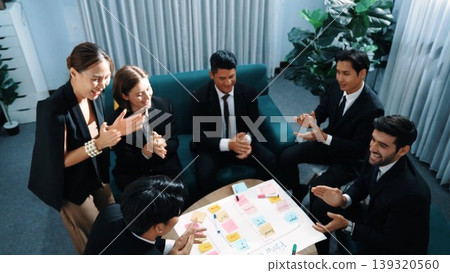 Top view of people putting hands together while using mind map. Directorate. Top view of people putting hands together while using mind map. Directorate. 139320560