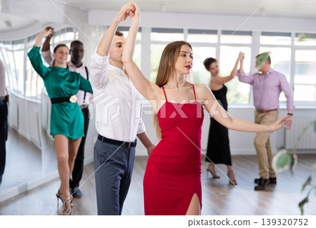 Man and woman dancing waltz in couple during lesson at studio Man and woman dancing waltz in couple during lesson at studio 139320752