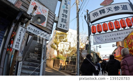 The lively atmosphere of Shibamata Shrine, a street full of old-town charm, and the tourists. The lively atmosphere of Shibamata Shrine, a street full of old-town charm, and the tourists. 139320783