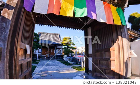 A view of the main hall and Jizo statue from the gate of Ryokanji Temple in Tokyo. A view of the main hall and Jizo statue from the gate of Ryokanji Temple in Tokyo. 139321042
