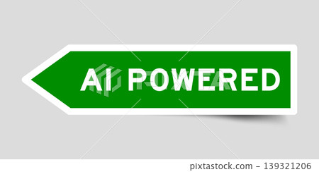 Green color arrow shape sticker label with word AI powered on gray background 139321206