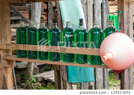 Bottled gasoline for sale along roads in Sulawesi, Indonesia Bottled gasoline for sale along roads in Sulawesi, Indonesia 139321601