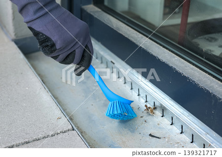 Maintenance of the terrace drainage system using a brush to clean the drain for reliable seasonal outdoor performance. Maintenance of the terrace drainage system using a brush to clean the drain for reliable seasonal outdoor performance. 139321717