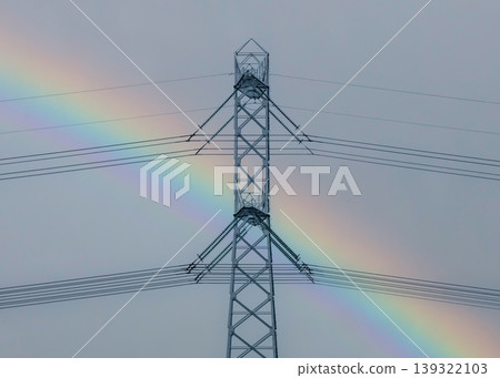 Rainbow Behind High Voltage Power Line Tower Rainbow Behind High Voltage Power Line Tower 139322103