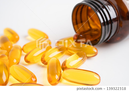 Fish oil or Cod liver oil gel in capsules with omega 3 vitamins, supplementary healthy food. 139322318