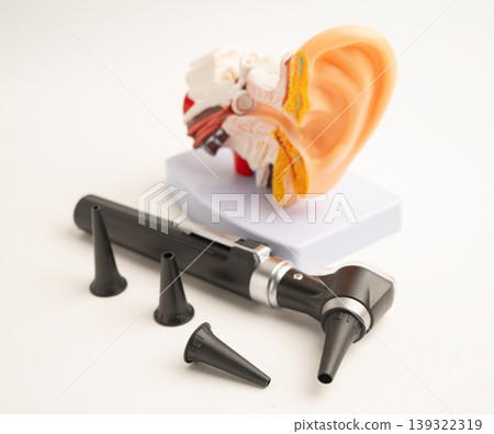 Otoscope with model for audiologist or ENT doctor use otoscope checking ear and treat hearing loss problem. Otoscope with model for audiologist or ENT doctor use otoscope checking ear and treat hearing loss problem. 139322319