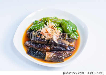 Grilled eggplant and bell peppers marinated in Japanese-style broth. A side dish of summer vegetables marinated in Japanese-style broth. (White background) Grilled eggplant and bell peppers marinated in Japanese-style broth. A side dish of summer vegetables marinated in Japanese-style broth. (White background) 139322499