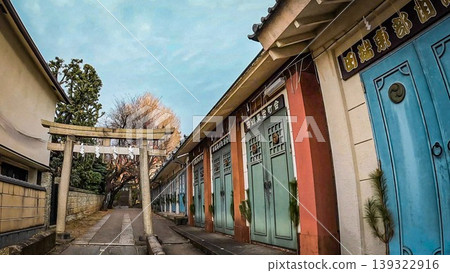 Colorful portable shrine storage buildings line the approach to Tabata Hachiman Shrine in Tokyo. Colorful portable shrine storage buildings line the approach to Tabata Hachiman Shrine in Tokyo. 139322916