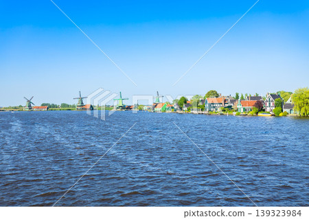 Windmills and traditional houses in Zaanse Schans, Netherlands Windmills and traditional houses in Zaanse Schans, Netherlands 139323984