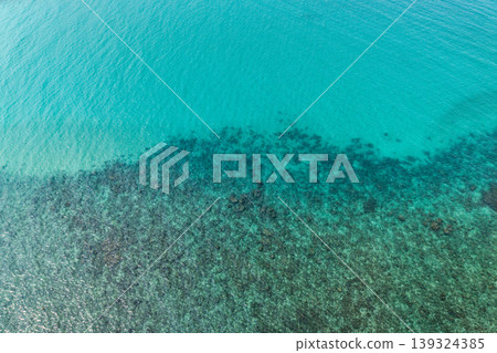 Aerial view of coral reefs and clear turquoise sea water in the Eastern Sea of Thailand. Aerial view of coral reefs and clear turquoise sea water in the Eastern Sea of Thailand. 139324385