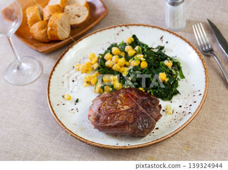 Baked or fried veal in plate with cheakpea Baked or fried veal in plate with cheakpea 139324944