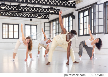 Group of people dancing dynamic contemporary Group of people dancing dynamic contemporary 139325000