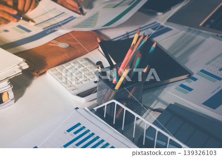Professional photo of a person's hands reviewing a contract or legal document on a desk, for concepts of business, finance, and legal affairs Professional photo of a person's hands reviewing a contract or legal document on a desk, for concepts of business, finance, and legal affairs 139326103