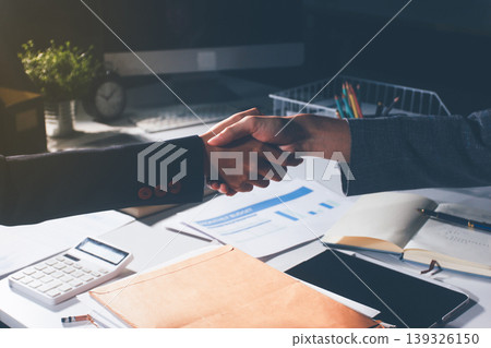 Professional photo of a person's hands reviewing a contract or legal document on a desk, for concepts of business, finance, and legal affairs Professional photo of a person's hands reviewing a contract or legal document on a desk, for concepts of business, finance, and legal affairs 139326150