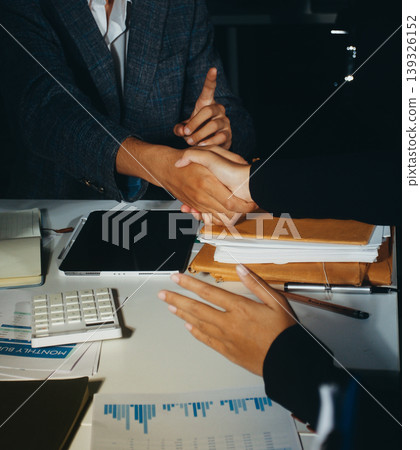 Professional photo of a person's hands reviewing a contract or legal document on a desk, for concepts of business, finance, and legal affairs Professional photo of a person's hands reviewing a contract or legal document on a desk, for concepts of business, finance, and legal affairs 139326152