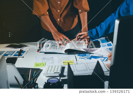 UXUI design brainstorming session with sketches and digital tools 139326171