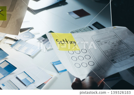 UXUI design brainstorming session with sketches and digital tools UXUI design brainstorming session with sketches and digital tools 139326183