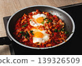 Homemade Shakshuka in Pan with Eggs and Vegetables 139326509