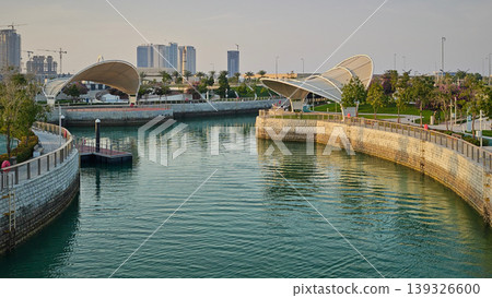 Qetaifan Island North, Lusail Qatar-February 12 2026: Majra Al Sail Park in Lusail offers canal views, lush gardens, kids' play areas, picnic zones, and walking trails along a 1.3 km saltwater canal. Qetaifan Island North, Lusail Qatar-February 12 2026: Majra Al Sail Park in Lusail offers canal views, lush gardens, kids' play areas, picnic zones, and walking trails along a 1.3 km saltwater canal. 139326600