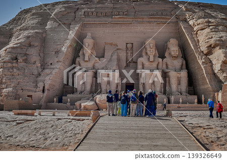 Abu Simbel, Aswan, Egypt- February 10 2025: Abu Simbel Temples in Abu Simbel Aswan, Egypt exterior daylight shot showing The Great Temple of Ramesses II with tourist at the main entrance Abu Simbel, Aswan, Egypt- February 10 2025: Abu Simbel Temples in Abu Simbel Aswan, Egypt exterior daylight shot showing The Great Temple of Ramesses II with tourist at the main entrance 139326649