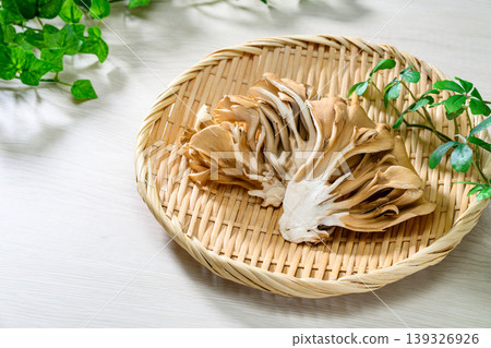 Fresh maitake mushrooms served in a bamboo basket Fresh maitake mushrooms served in a bamboo basket 139326926