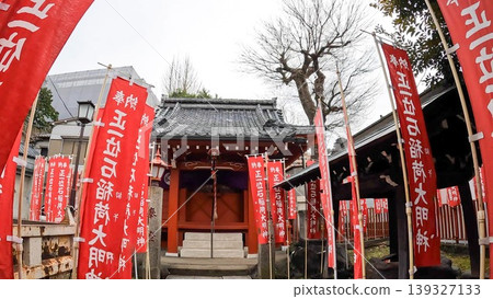 Ishi Inari Shrine, Tokyo: An Inari shrine standing on a street corner in Negishi, Tokyo. Ishi Inari Shrine, Tokyo: An Inari shrine standing on a street corner in Negishi, Tokyo. 139327133