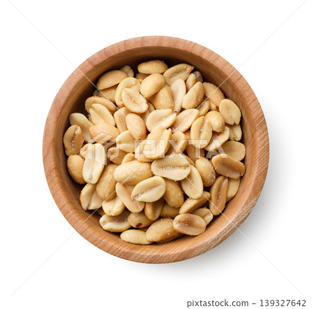 Salted roasted peanuts in a wooden bowl on a white background. Top view Salted roasted peanuts in a wooden bowl on a white background. Top view 139327642
