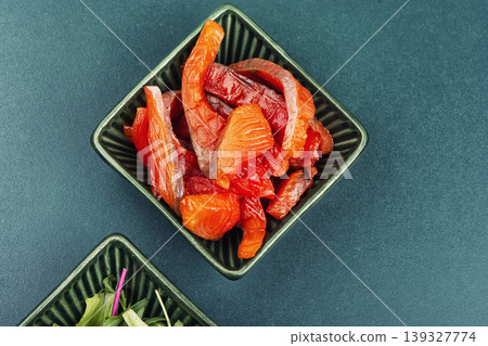 Cured salmon pieces with greens on table Cured salmon pieces with greens on table 139327774