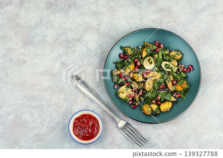 Gourmet seafood salad with greens and pomegranate seeds Gourmet seafood salad with greens and pomegranate seeds 139327788