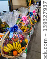 Festive fruit baskets are on sale at the market. Festive bouquets. 139327937