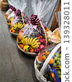 Festive fruit baskets are on sale at the market. Festive bouquets. 139328011